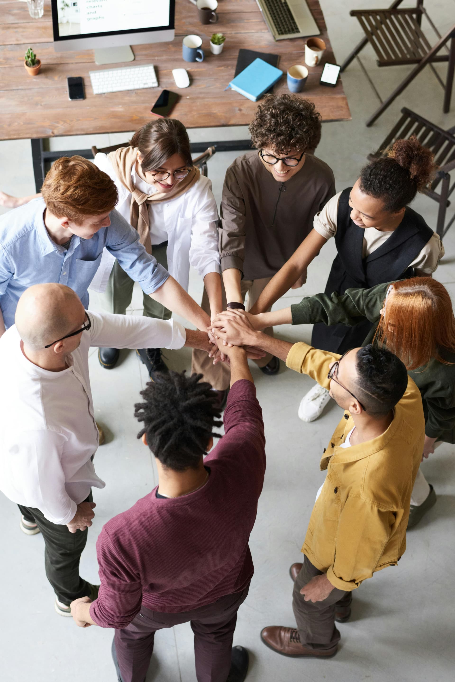 Hands stacked together in support